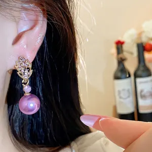 Elegant minimalist purple pearl drop earrings featuring a sparkling crystal leaf design for women