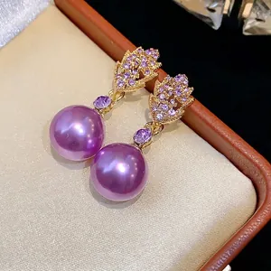 Elegant gold-tone leaf dangle earrings with purple pearls and shimmering crystals for women