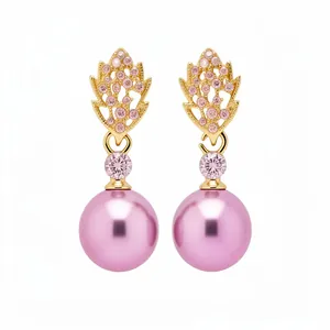 Elegant gold-tone leaf earrings featuring pink crystals and smooth round pink pearls