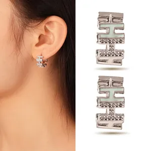 Elegant silver stacked H letter earrings with mint green enamel and sparkling crystal pavé details