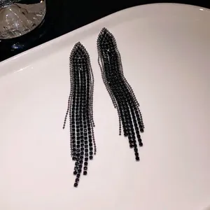 Elegant long black rhinestone tassel earrings featuring a stylish triangular design