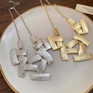 Elegant vintage metal square pattern stitching necklace with textured geometric plates