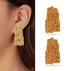 Exaggerated gold stainless steel stud earrings featuring an irregular melted lava texture for women