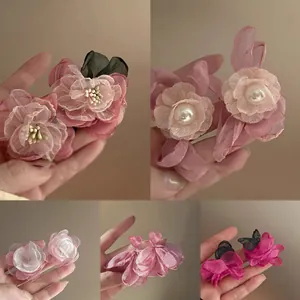 Elegant handmade pink fabric flower earrings with pearl accents in various stylish designs