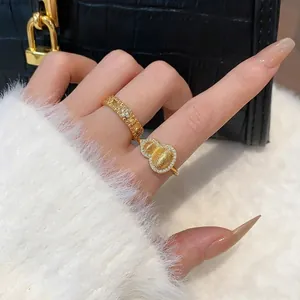 Elegant gold plated Hulu gourd and flower ring set with sparkling zircons for women.