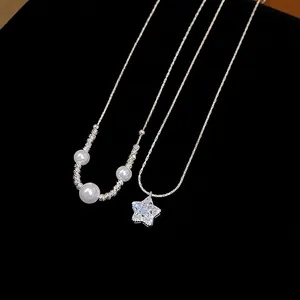 Elegant French style zircon star and pearl necklace with silver chain on black base