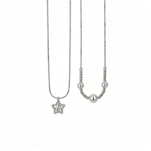 Elegant silver-toned zircon star and metallic bead pendant necklaces on thin chains