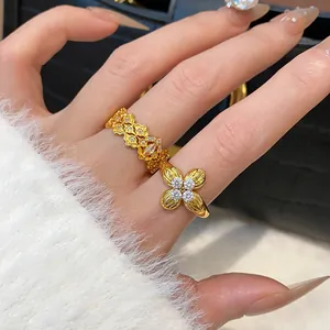 Close-up of gold-plated zircon flower ring on hand showing luxury minimalist style