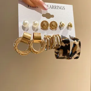 Close-up of a diverse six-pair earring set with leopard print and gold accents