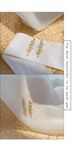 Detail view of colorful pastel candy flower drop earrings with silver needle