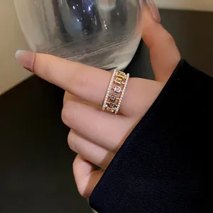 Elegant vintage gold open ring with delicate pearls and sparkling square zirconia stones