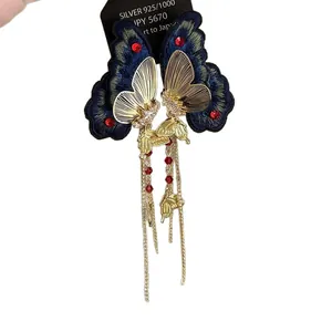 Vintage navy butterfly wing open ring with red beads and long elegant gold chain tassels