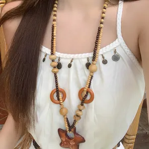 Collana con Pendente a Stella e Luna in Perline di Legno Bohemian Catena a Clavicola Lunga Etnica Vintage per Donna Gioielli Vacanza