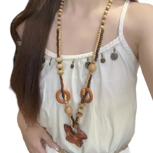 Collana bohémien di perle in legno con ciondolo a stella vintage ideale per vacanze