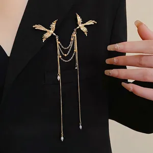 Elegant new Chinese style golden phoenix brooch with long pearl tassels on a black blazer
