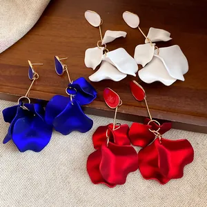 Detailed view of elegant petal drop earrings in white, blue, and red matte finish