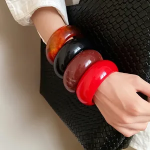 Retro chunky round resin bangles set in amber black brown and red for fashion jewelry