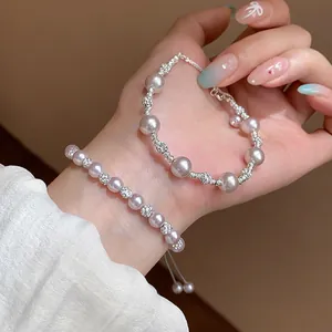 Close-up detail of elegant French style pink pearl bracelets with sparkling zircon beads