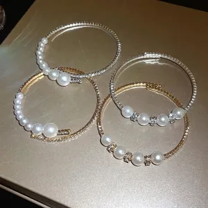 Baroque pearl and rhinestone open bracelets in elegant gold and silver finishes