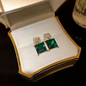 Elegant emerald green square geometric crystal stud earrings in luxury gold-tone setting
