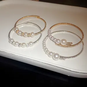 Elegant baroque pearl bracelets with diamond accents in gold and silver metal finishes