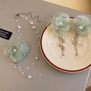 Elegant light green mesh flower necklace with faux pearls and zircon drops for women
