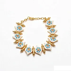 Elegant vintage style enamel heart charm bracelet with gold-plated finish and blue details