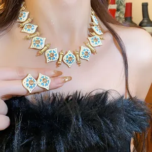 Detailed view of vintage style enamel jewelry set with heart pattern on a model