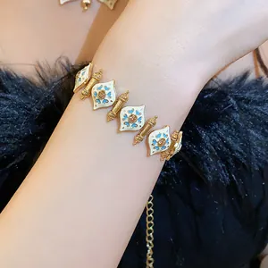 Close-up of vintage heart enamel bracelet with gold-tone finish and crystal detail