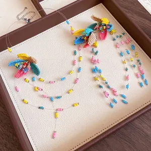 Handmade colorful beaded flower necklace and earrings set with long tassels for vacation