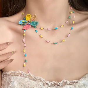 Close-up of a sweet resort style handmade colorful beaded flower collarbone necklace