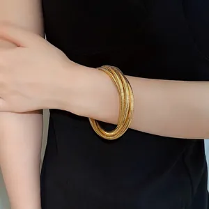 Elegant gold multi-layer spring coiled bracelet for women, minimalist metal style jewelry