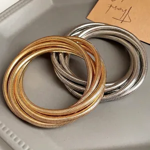 Niche minimalist multi-layer metallic spring bracelets in gold and silver finish