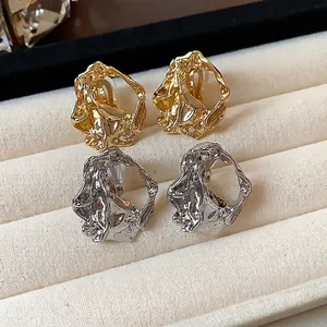 Luxurious 18k gold plated crumpled geometric ear clips in polished gold and silver finishes