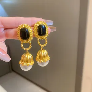 Elegant vintage French court style earrings with black stones and pearls on gold frames