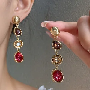 Vintage gold drop earrings with tiered multi-colored crystals and French palace style