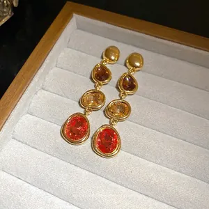 French vintage triple gemstone dangle earrings in gold-tone setting, presented in box
