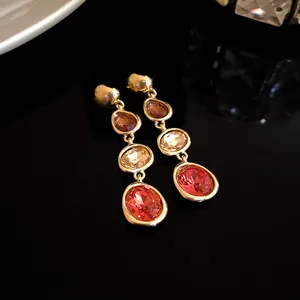 Elegant French court style drop earrings with gradient multi-colored gemstones and gold