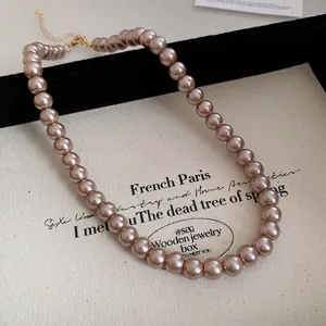 Elegant mauve pearl necklace for women featuring French vintage style and a secure golden clasp