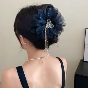 Elegant navy blue chiffon flower hair claw with long metallic tassels and rhinestones