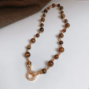 Elegant brown tiger eye beaded necklace variant with gold rhinestone clasp detail for women