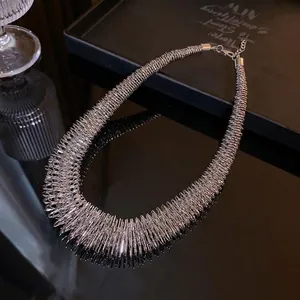 Minimalist silver spring-textured metallic choker necklace with a sleek and modern design