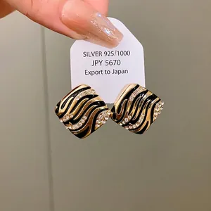 Elegant geometric square earrings with black enamel zebra stripes and rhinestones