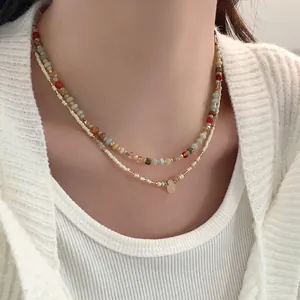 Elegant double-layered necklace with colorful crystal beads and gold-tone accents.