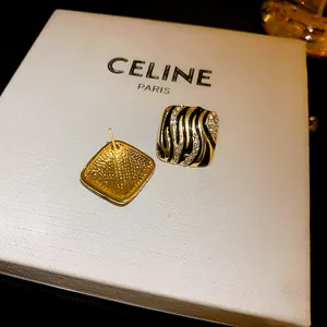 Detailed view of square zebra print stud earrings with rhinestones on a white display box
