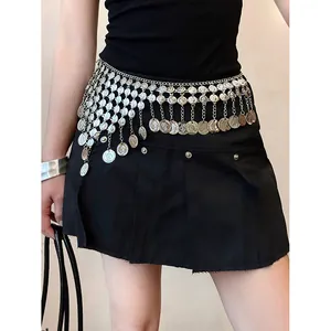 Detail of silver coin tassel waist chain on black skirt for chic styling