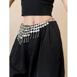 Detailed view of bohemian silver metal waist chain with coin tassels and mini bell charms