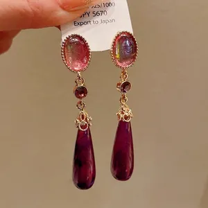 Vintage palace style teardrop earrings with purple marble stone and silver needle.