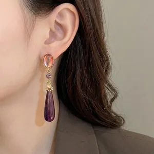 Vintage elegant teardrop dangle earrings with purple crystals and gold-tone finish