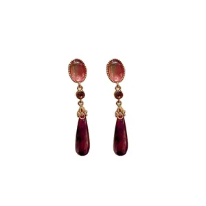 Vintage palace style drop earrings with purple rhinestones and elegant gold-tone finish